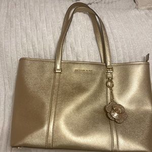 EUC Michael Kors Large Gold Tote with added Michael Kors Flower Charm